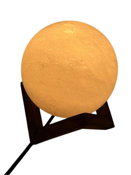 Himalaya Pink Sphere Salt Lamp 6 Inch glowing warmly on a modern metal stand by Crystal Mines Australia, handcrafted from authentic Himalayan pink rock salt.