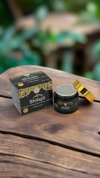 Pure Himalayan Shilajit Resin 25g displayed on a wooden table by Crystal Mines Australia.